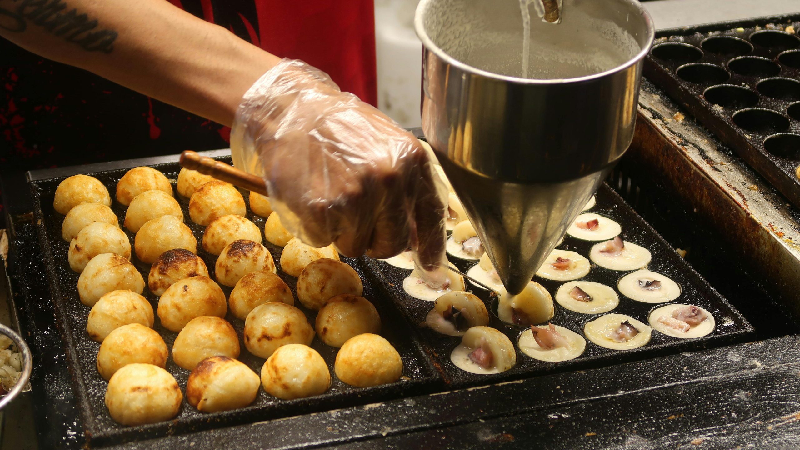 Street food vendor preparing Takoyaki